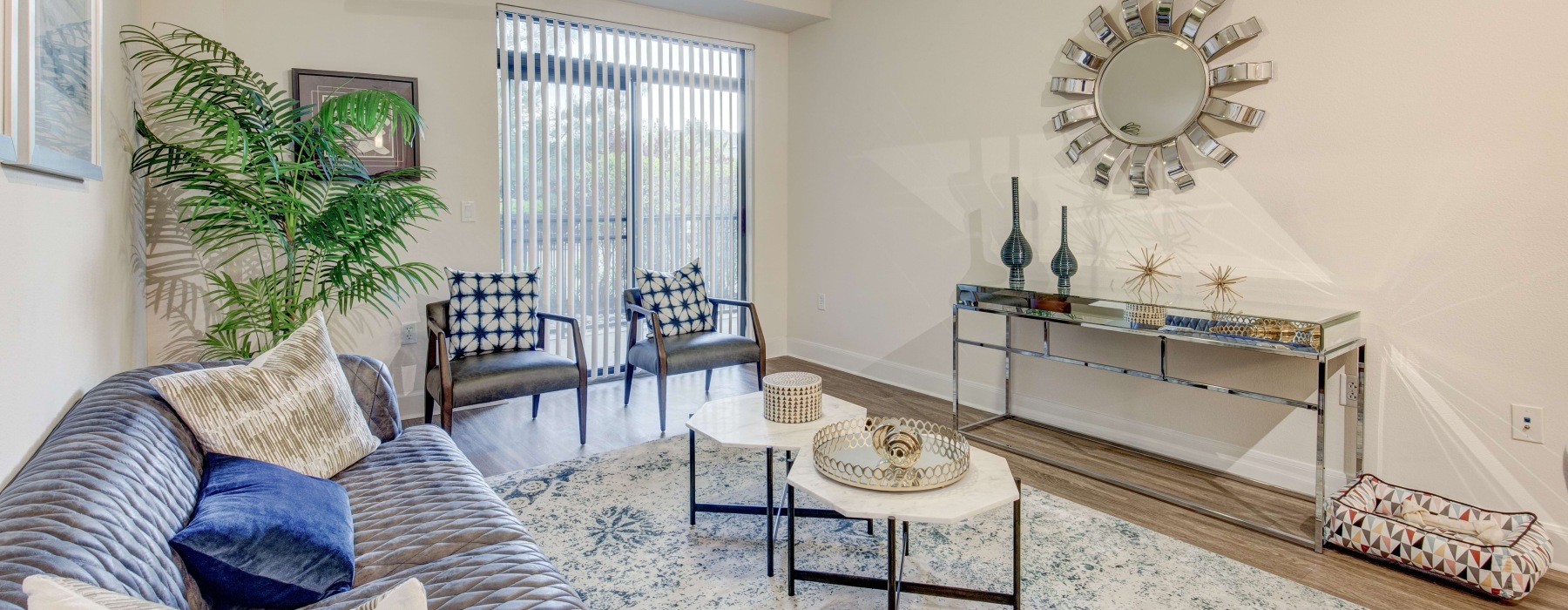 bright living room with access to private balcony