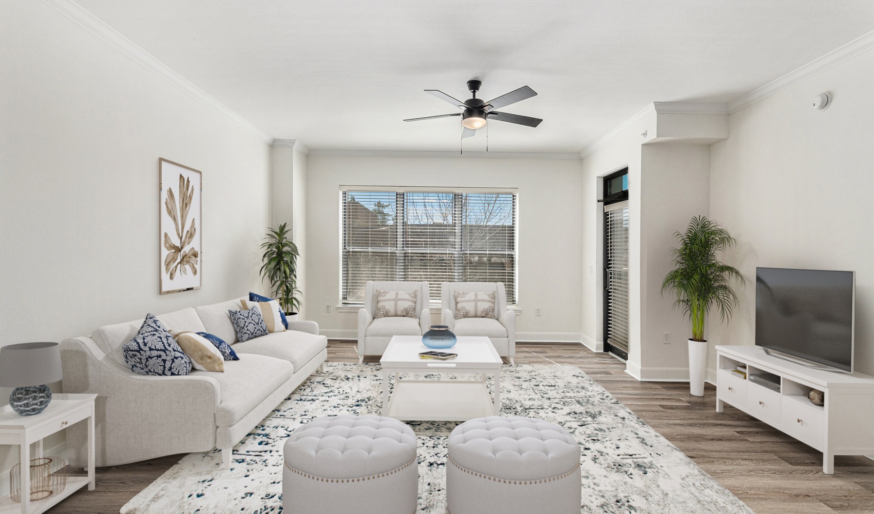 Living room with chairs and couches on vinyl plank flooring