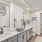 Spacious bathroom with a large vanity and mirror
